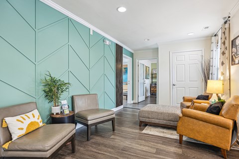 a living room with a blue wall and furniture